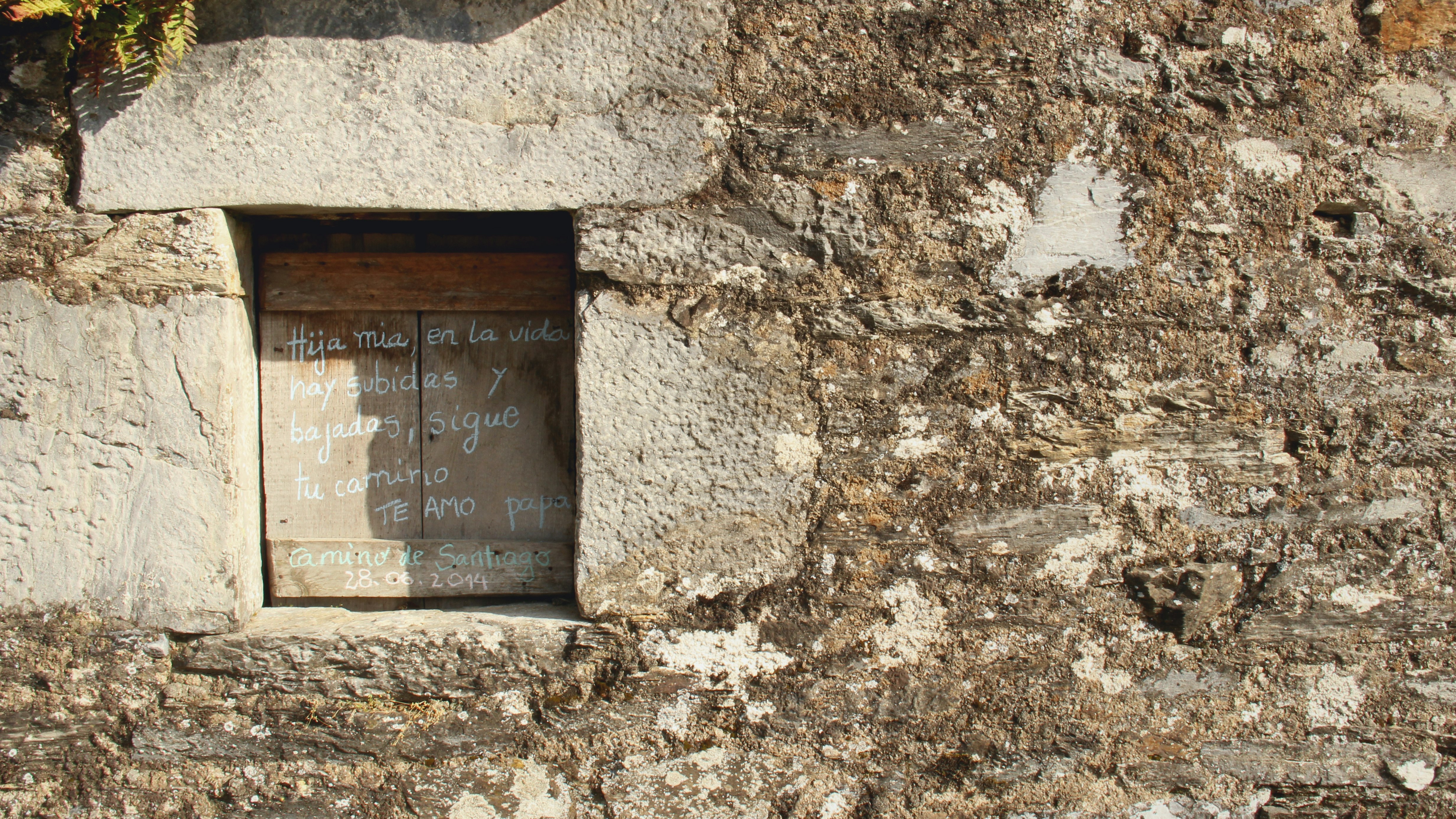 brown wooden frame on gray concrete wall